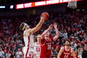 Nebraska Cornhusker guard Sam Hoiberg (1) drives to the basket for a lay up against Wisconsin Badger forward Steven Crowl (22) in the second half during a college basketball game on Thursday, February 1, 2024, in Lincoln, Nebraska. Photo by John S. Peterson.