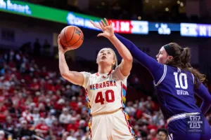 Nebraska Cornhusker center Alexis Markowski (40) makes a lay up against Northwestern Wildcat forward Caileigh Walsh (10) in the first quarter during a college basketball game Tuesday, February 20, 2024, in Lincoln, Neb. Photo by John S. Peterson.