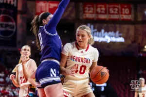 Nebraska Cornhusker center Alexis Markowski (40) drives into Northwestern Wildcat forward Caileigh Walsh (10) in the first quarter during a college basketball game Tuesday, February 20, 2024, in Lincoln, Neb. Photo by John S. Peterson.