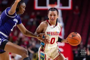 Nebraska Cornhusker guard Darian White (0) dribbles the ball against Northwestern Wildcat forward Mercy Ademusayo (13) in the first quarter during a college basketball game Tuesday, February 20, 2024, in Lincoln, Neb. Photo by John S. Peterson.