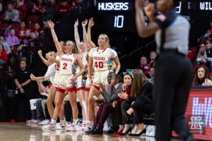 Nebraska Cornhuskers bench celebrates a three poiont shot against the Northwestern Wildcats in the first quarter during a college basketball game Tuesday, February 20, 2024, in Lincoln, Neb. Photo by John S. Peterson.