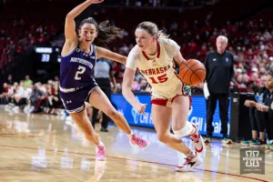 Nebraska Cornhusker guard Kendall Moriarty (15) drives to the basket against Northwestern Wildcat guard Caroline Lau (2) in the second quareter during a college basketball game Tuesday, February 20, 2024, in Lincoln, Neb. Photo by John S. Peterson.
