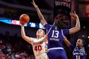 Nebraska Cornhusker center Alexis Markowski (40) makes a lay up against Northwestern Wildcat forward Mercy Ademusayo (13) in the second quarter during a college basketball game Tuesday, February 20, 2024, in Lincoln, Neb. Photo by John S. Peterson.