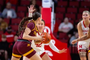 Nebraska Cornhusker guard Maddie Krull (42) defends against a Minnesota Golden Gopher player in the first half during a college basketball game Saturday, February 24, 2024, in Lincoln, Neb. Photo by John S. Peterson.
