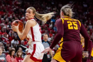 Nebraska Cornhusker forward Natalie Potts (22) looking to make a move on Minnesota Golden Gopher guard Grace Grocholski (25) in the first half during a college basketball game Saturday, February 24, 2024, in Lincoln, Neb. Photo by John S. Peterson.