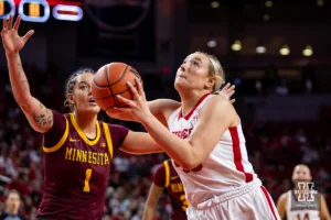 Nebraska Cornhusker center Alexis Markowski (40) makes lay up against Minnesota Golden Gopher forward Ayianna Johnson (1) in the firsrt half during a college basketball game Saturday, February 24, 2024, in Lincoln, Neb. Photo by John S. Peterson.