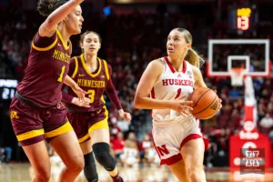Nebraska Cornhusker guard Jaz Shelley (1) drives to the lane against Minnesota Golden Gopher forward Ayianna Johnson (1) during a college basketball game Saturday, February 24, 2024, in Lincoln, Neb. Photo by John S. Peterson.