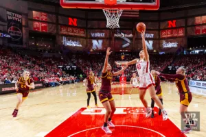 Nebraska Cornhusker center Alexis Markowski (40) puts up a lay up against Minnesota Golden Gopher forward Ayianna Johnson (1) during a college basketball game Saturday, February 24, 2024, in Lincoln, Neb. Photo by John S. Peterson.