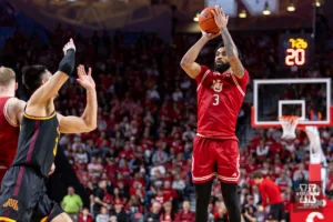 Nebraska Cornhusker guard Brice Williams (3) makes a three point shot against the Minnesota Golden Gophers in the first half during a college basketball game Sunday, February 25, 2024, in Lincoln, Neb. Photo by John S. Peterson.