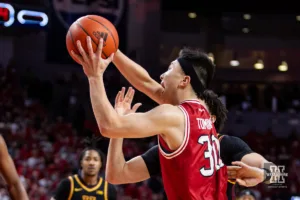 Nebraska Cornhusker guard Keisei Tominaga (30) makes a lay up against the Minnesota Golden Gophers in the first half during a college basketball game Sunday, February 25, 2024, in Lincoln, Neb. Photo by John S. Peterson.