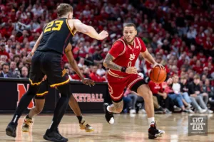Nebraska Cornhusker guard C.J. Wilcher (0) driibbles the ball against Minnesota Golden Gopher forward Parker Fox (23) in the first half during a college basketball game Sunday, February 25, 2024, in Lincoln, Neb. Photo by John S. Peterson.