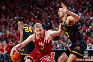 Nebraska Cornhusker forward Rienk Mast (51) drives into Minnesota Golden Gopher forward Dawson Garcia (3) in the second half during a college basketball game Sunday, February 25, 2024, in Lincoln, Neb. Photo by John S. Peterson.