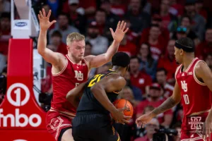 Nebraska Cornhusker forward Rienk Mast (51) defends against Minnesota Golden Gopher forward Pharrel Payne (21) in the second half during a college basketball game Sunday, February 25, 2024, in Lincoln, Neb. Photo by John S. Peterson.