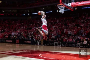 Nebraska Cornhusker football player Thomas Fidone III (24) performs in the halftime dunk contest during a college basketball game against the Minnesota Golden Gophers Sunday, February 25, 2024, in Lincoln, Neb. Photo by John S. Peterson.