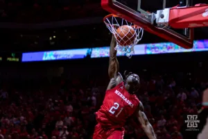 Nebraska Cornhusker football player Emmett Johnson (21) performs in the halftime dunk contest during a college basketball game against the Minnesota Golden Gophers Sunday, February 25, 2024, in Lincoln, Neb. Photo by John S. Peterson.