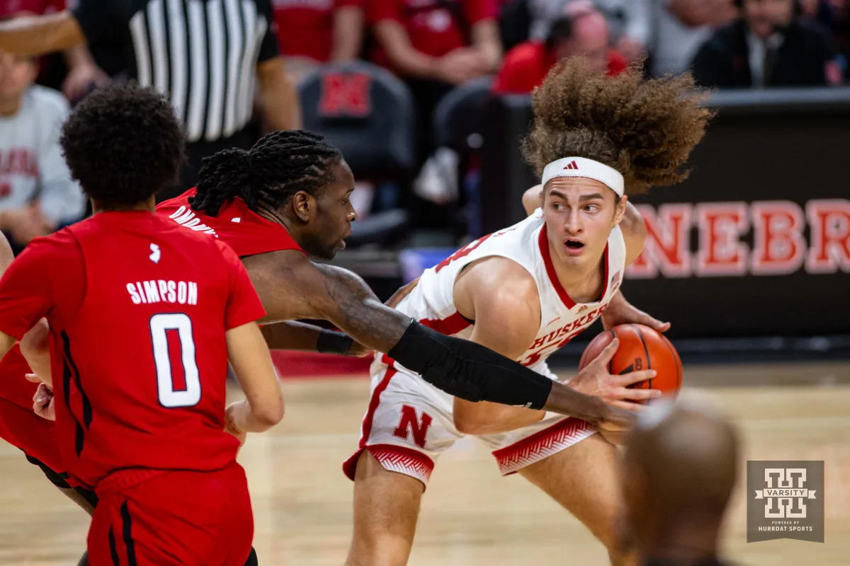 Nebraska Cornhusker forward Josiah Allick (53) dribbles the ball against Rutgers Scarlet Knight center Clifford Omoruyi (11) in the first half during a college basketball game Sunday, March 3, 2024, in Lincoln, Neb. Photo by John S. Peterson.