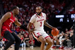 Nebraska Cornhusker guard Brice Williams (3) dribbles the ball against Rutgers Scarlet Knight forward Aundre Hyatt (5) int ehs  during a college basketball game Sunday, March 3, 2024, in Lincoln, Neb. Photo by John S. Peterson.