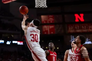 Nebraska Cornhusker guard Keisei Tominaga (30) tries for a lay up against Rutgers Scarlet Knights in the first half during a college basketball game Sunday, March 3, 2024, in Lincoln, Neb. Photo by John S. Peterson.