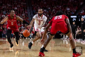 Nebraska Cornhusker guard Brice Williams (3) makes a pass against Rutgers Scarlet Knight guard Jeremiah Williams (25) and Aundre Hyatt in the first half during a college basketball game Sunday, March 3, 2024, in Lincoln, Neb. Photo by John S. Peterson.