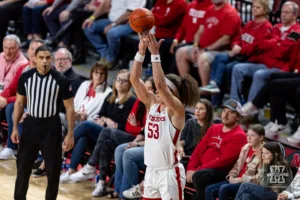 Nebraska Cornhusker forward Josiah Allick (53) makes a three point shot from the corner against the Rutgers Scarlet Knights in the second half during a college basketball game Sunday, March 3, 2024, in Lincoln, Neb. Photo by John S. Peterson.