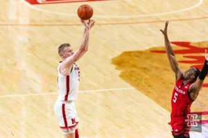 Nebraska Cornhusker forward Rienk Mast (51) makes a three point shot against Rutgers Scarlet Knight forward Aundre Hyatt (5) in the second half during a college basketball game Sunday, March 3, 2024, in Lincoln, Neb. Photo by John S. Peterson.