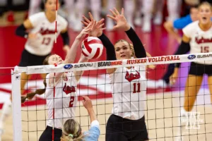 Nebraska Cornhusker Bergen Reilly (2) and Leyla Blackwell block a shot against the Texas A&M CC Islanders during the college volleyball game Friday, August 30, 2024, in Lincoln, Nebraska. Photo John S. Peterson.