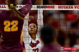 Nebraska Cornhusker Harper Murray (27) jumps up to block the ball against the Arizona State Sundevils in the second set during the college volleyball match Friday, September 13, 2024, in Lincoln, Nebraska. Photo John S. Peterson.