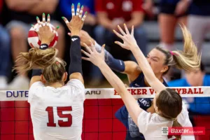 Nebraska Cornhusker middle blocker Andi Jackson (15) blocks a spike from Creighton Bluejay outside hitter Ava Martin (8) in the seconed set during the college volleyball match Tuesday, September 10, 2024, in Lincoln, Nebraska. Photo John S. Peterson.