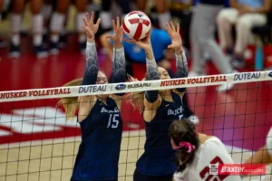 Creighton Bluejay middle blocker Kiara Reinhardt (5) blocks a spike from Nebraska Cornhusker outside hitter Lindsay Krause (22) in the fourth set during the college volleyball match Tuesday, September 10, 2024, in Lincoln, Nebraska. Photo John S. Peterson.