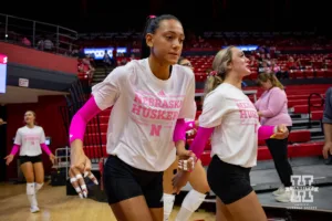 Nebraska Cornhusker Harper Murray (27) runs out on the court for warm-ups before taking on the Rutgers Scarlet Knights during a college volleyball match Saturday, October 12, 2024, in Lincoln, Nebraska. Photo by John S. Peterson.