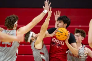 Nebraska Cornhusker Berke Büyüktuncel (9) drives to the basket against Sam Hoiberg during a scrimmage Sunday, October 13, 2024, in Lincoln, Nebraska. Photo by John S. Peterson.