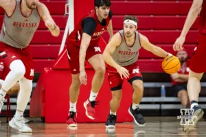 Nebraska Cornhusker Sam Hoiberg (gray) dribbles the ball after grabbing the rebound during a scrimmage Sunday, October 13, 2024, in Lincoln, Nebraska. Photo by John S. Peterson.