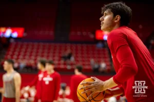 Nebraska Cornhusker Berke Büyüktuncel (9) lines up a three point shot warming up during a scrimmage Sunday, October 13, 2024, in Lincoln, Nebraska. Photo by John S. Peterson.