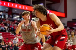 ebraska Cornhusker Connor Essegian (gray) reaches for the ball against Braxton Meah (red) during a scrimmage Sunday, October 13, 2024, in Lincoln, Nebraska. Photo by John S. Peterson.