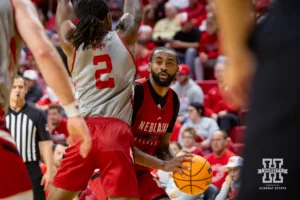 Nebraska Cornhusker Brice Williams (red) looks for a shot against Ahron Ulis (2) during a scrimmage Sunday, October 13, 2024, in Lincoln, Nebraska. Photo by John S. Peterson.