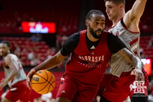 Nebraska Cornhusker Brice Williams (red) drives to the basket against Nick Janowski (gray) during a scrimmage Sunday, October 13, 2024, in Lincoln, Nebraska. Photo by John S. Peterson.