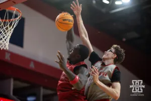 Nebraska Cornhusker Juwan Gary (red) grabs a rebound against Gavin Griffiths (gray) during a scrimmage Sunday, October 13, 2024, in Lincoln, Nebraska. Photo by John S. Peterson.