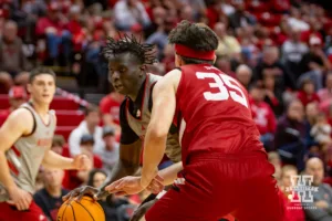 Nebraska Cornhusker Justin Bolis (gray) drives to the basket against Henry Burt (35) during a scrimmage Sunday, October 13, 2024, in Lincoln, Nebraska. Photo by John S. Peterson.