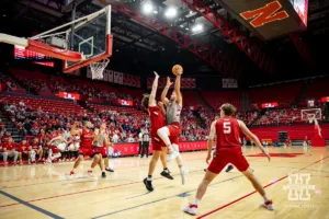 Nebraska Cornhusker Andrew Morgan (gray) drives to the basket for a lay up against Braxton Meah (red) during a scrimmage Sunday, October 13, 2024, in Lincoln, Nebraska. Photo by John S. Peterson.