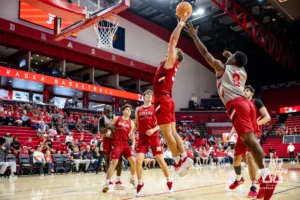 Nebraska Cornhusker Cale Jacobsen (31) reaches for the rebound against Jeffrey Grace III (8) during a scrimmage Sunday, October 13, 2024, in Lincoln, Nebraska. Photo by John S. Peterson.