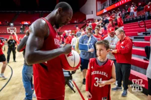 Nebraska Cornhusker Juwan Gary signs an autography for a young fan after the scrimmage Sunday, October 13, 2024, in Lincoln, Nebraska. Photo by John S. Peterson.