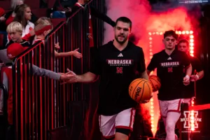 Nebraska Cornhusker Rollie Worster (24) leading the Huskers out to the court to take on Grand Valley State Lakers during a college men’s basketball game Thursday, October 27, 2024, in Lincoln, Nebraska. Photo by John S. Peterson.