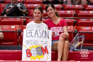 Nebraska Cornhusker fans showing up early to watch warm-ups and showing off their sign during a college volleyball match against the Purdue Boilermakers Friday, October 11, 2024, in Lincoln, Nebraska. Photo by John S. Peterson.