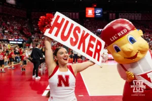 Nebraska Cornhusker cheerleader and Lil' Red getting the fans fired up for the Purdue Boilermakers during a college volleyball match Friday, October 11, 2024, in Lincoln, Nebraska. Photo by John S. Peterson.