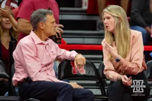 Nebraska Cornhusker head coach John Cook talks to Rutgers Scarlet Knight head coach Caitlin Schweihofer before the match during a college volleyball match Saturday, October 12, 2024, in Lincoln, Nebraska. Photo by John S. Peterson.