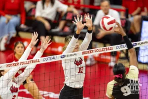 Nebraska Cornhusker Andi Jackson (15) jumps up to block Purdue Boilermaker middle blocker Lourdès Myers (9) during a college volleyball match Friday, October 11, 2024, in Lincoln, Nebraska. Photo by John S. Peterson.