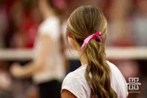 Nebraska Cornhusker Maisie Boesiger (7) has a pink ribbon in her hair for breast cancer awareness during a college volleyball match against the Rutgers Scarlet Knights Saturday, October 12, 2024, in Lincoln, Nebraska. Photo by John S. Peterson.