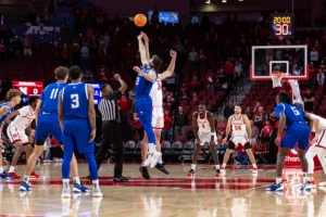 Nebraska Cornhusker Braxton Meah (34) and Grand Valley State Laker Ethan Alderink (13) jump for the opening tip during a college men’s basketball game Thursday, October 27, 2024, in Lincoln, Nebraska. Photo by John S. Peterson.