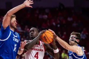 Nebraska Cornhusker Juwan Gary (4) battles for the ball against Grand Valley State Laker William Dunn (11) and Grand Valley State Laker Ethan Alderink (13) during a college men’s basketball game Thursday, October 27, 2024, in Lincoln, Nebraska. Photo by John S. Peterson.