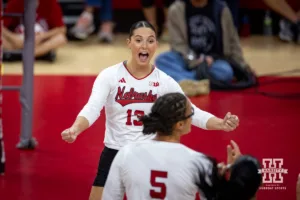 Nebraska Cornhusker Merritt Beason (13) celebrates a point against the Purdue Boilermakers in the first set during a college volleyball match Friday, October 11, 2024, in Lincoln, Nebraska. Photo by John S. Peterson.